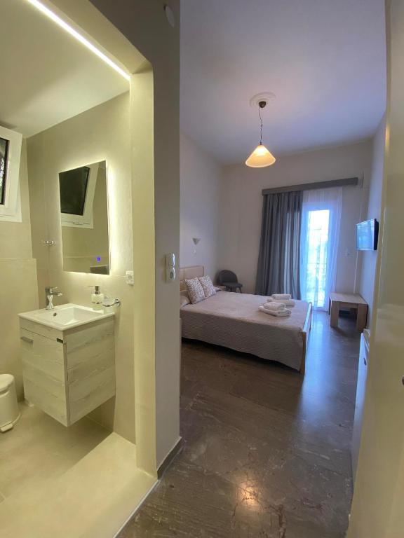 Postel nebo postele na pokoji v ubytování Hotel Pavlos - Studios