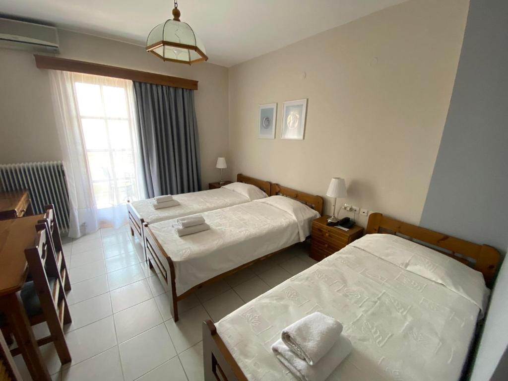 Postel nebo postele na pokoji v ubytování Hotel Pavlos - Studios