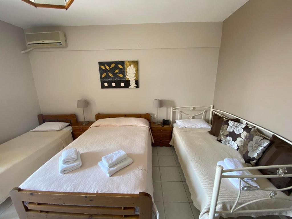 Postel nebo postele na pokoji v ubytování Hotel Pavlos - Studios