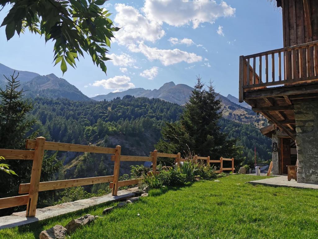 a view of the mountains from a house at Chalet La Foux - Ancienne ferme rénovée in Allos
