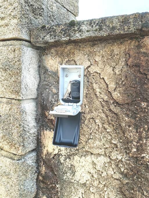 a phone on the side of a stone wall at Cadre d&#39;exception in Orange