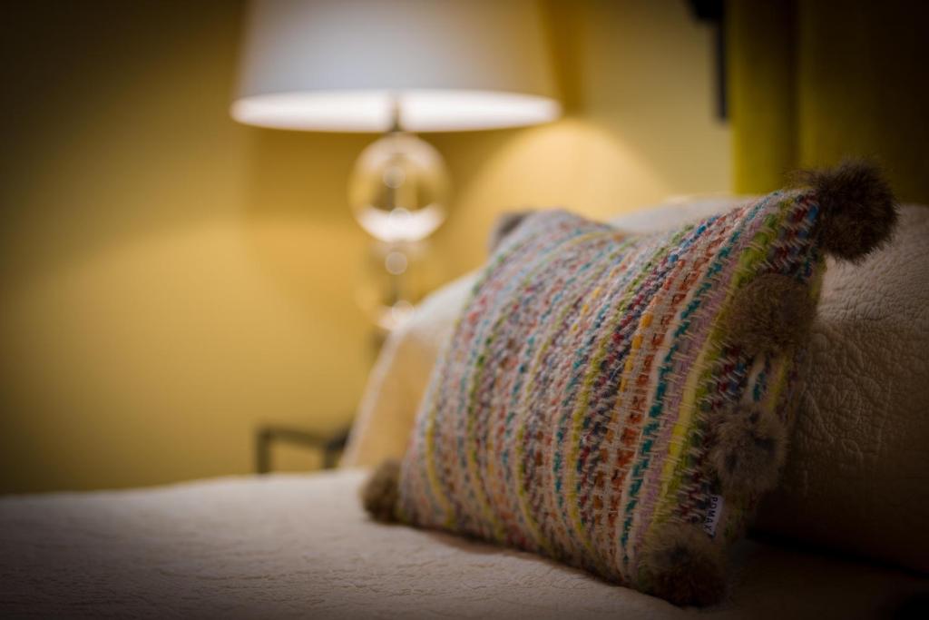 Postel nebo postele na pokoji v ubytování Hotel Carabeo