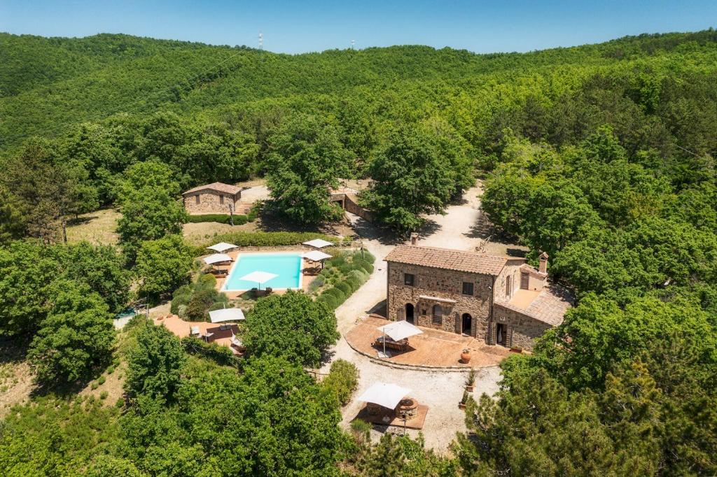 an aerial view of a house in the woods at PODERE SANTA CROCE 10, Emma Villas in Radicondoli