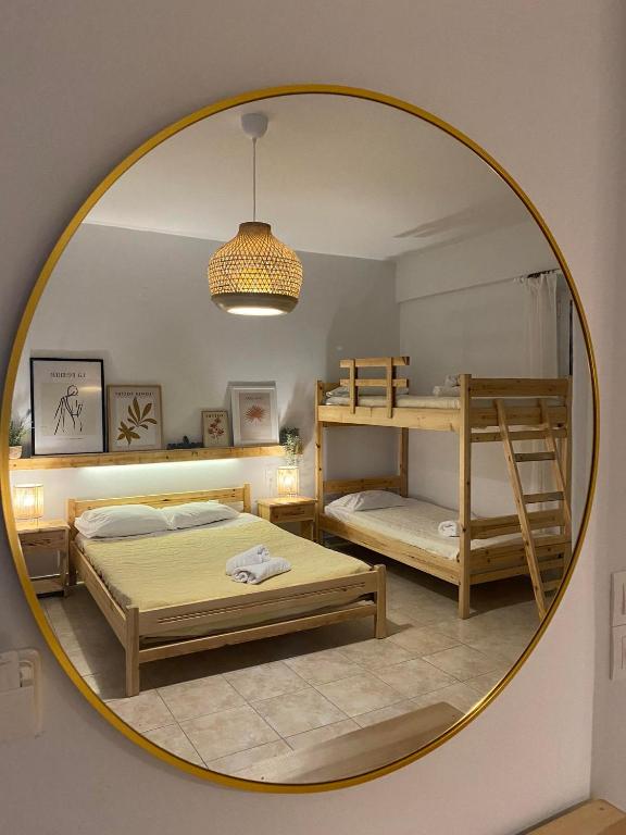 Postel nebo postele na pokoji v ubytování Aithrio Hotel