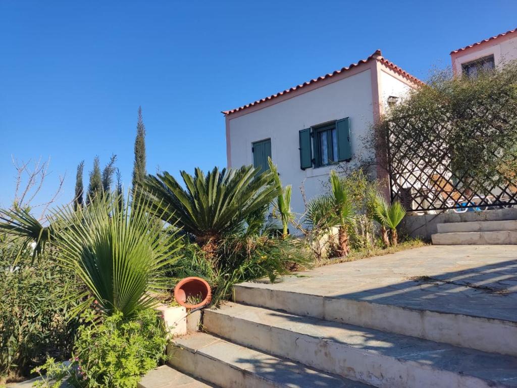 a house with some stairs in front of it at KATKA Karavas in Kythira