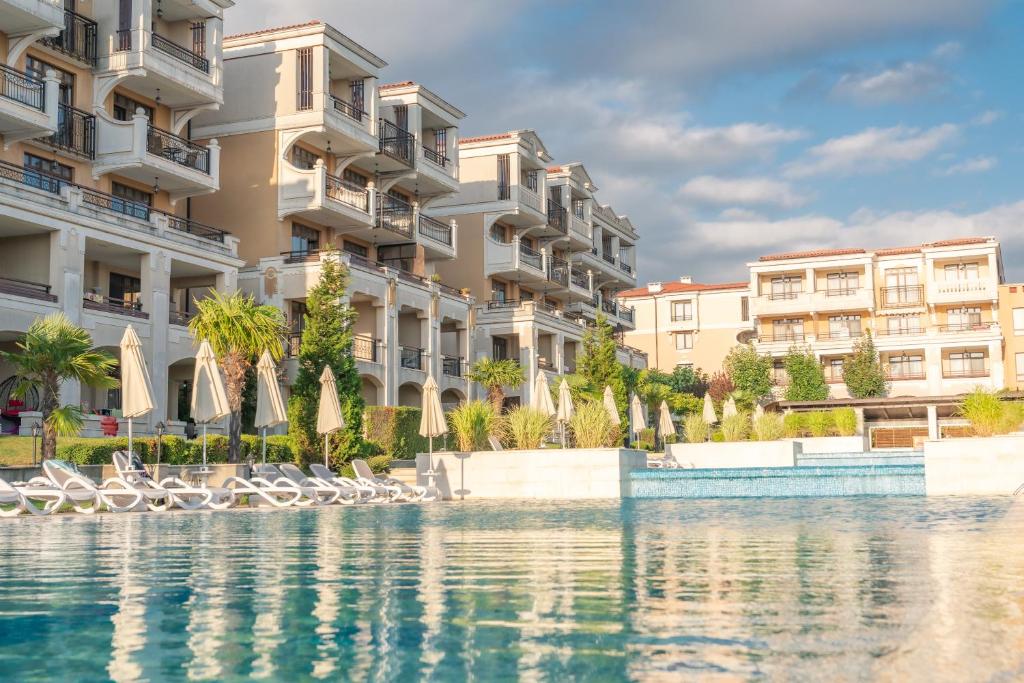 a rendering of a building with water in front at Green Life Apartments Sozopol in Sozopol