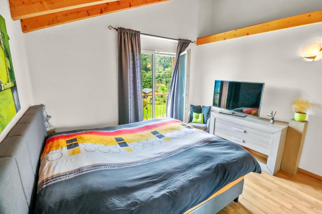 Postel nebo postele na pokoji v ubytování Logement avec vue sur la plaine