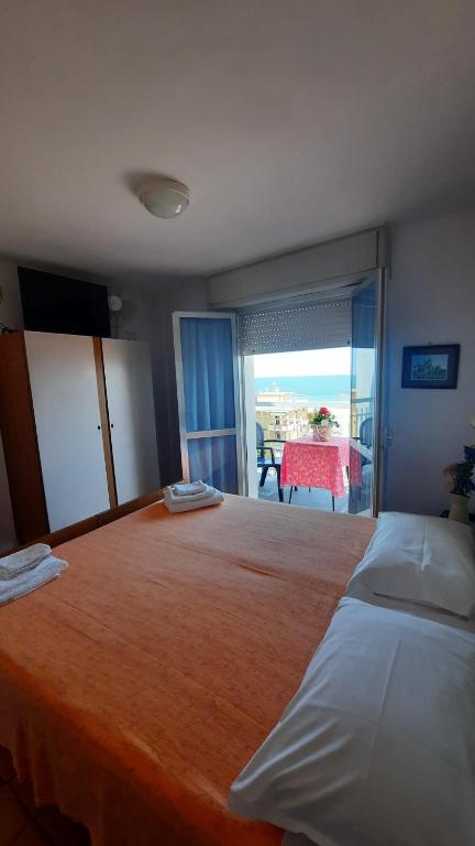 Postel nebo postele na pokoji v ubytování Albergo Rita