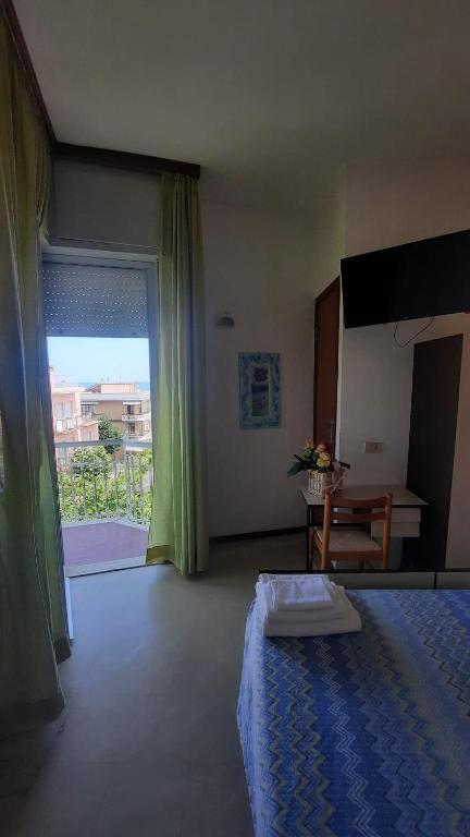 Postel nebo postele na pokoji v ubytování Albergo Rita