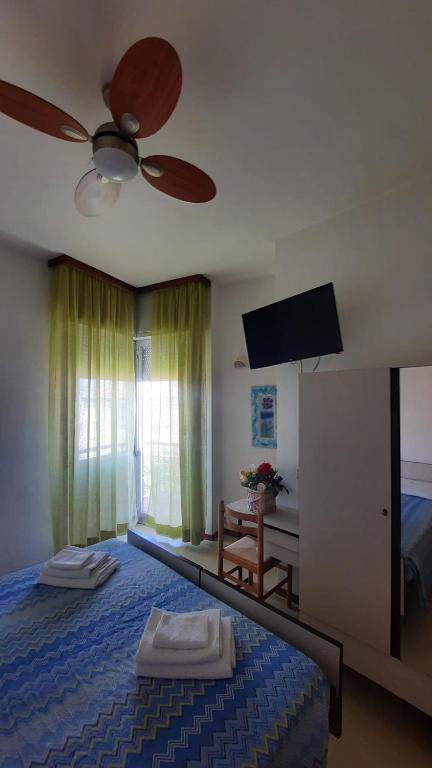 Postel nebo postele na pokoji v ubytování Albergo Rita