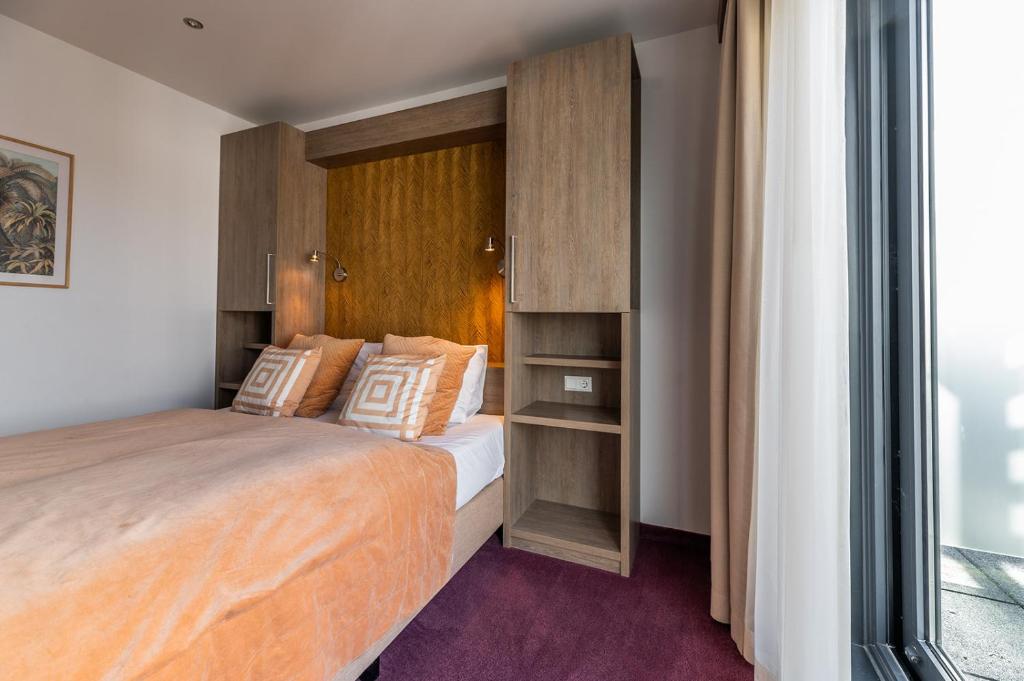 Postel nebo postele na pokoji v ubytování Hotel Bru