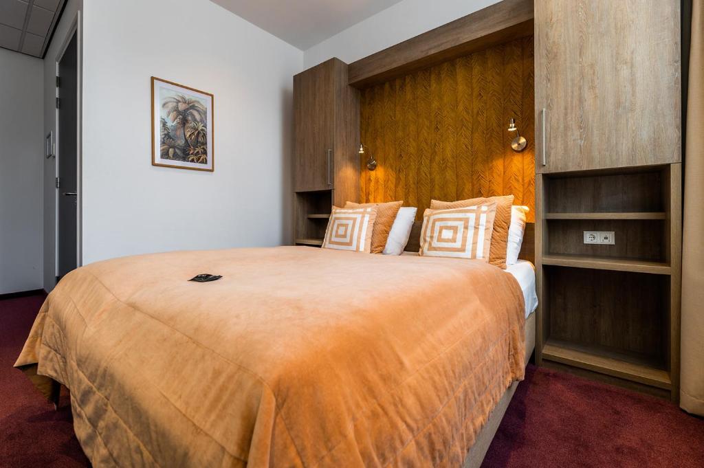 Postel nebo postele na pokoji v ubytování Hotel Bru