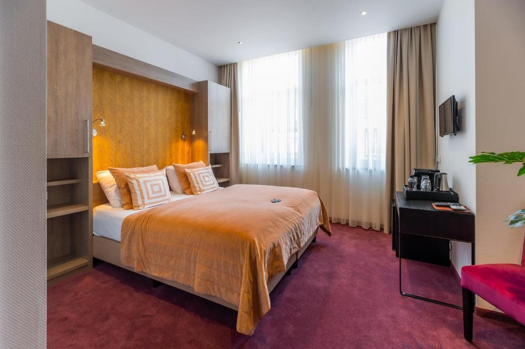 Postel nebo postele na pokoji v ubytování Hotel Bru