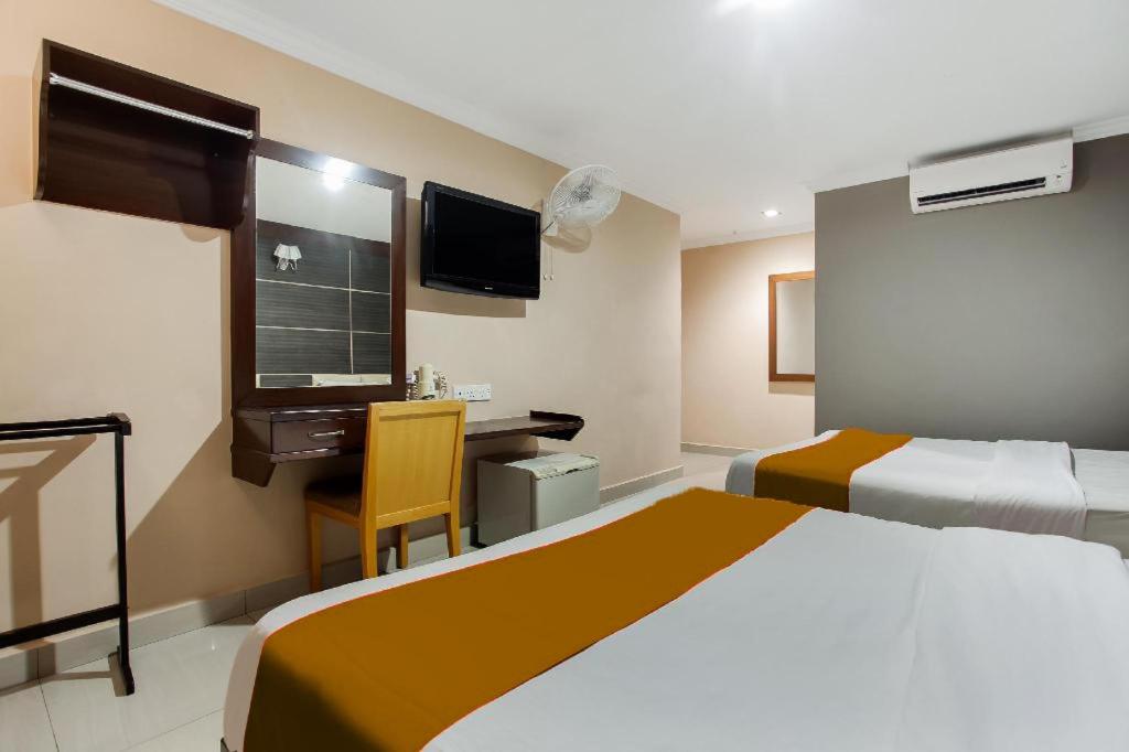 Postel nebo postele na pokoji v ubytování Sejati Hotel