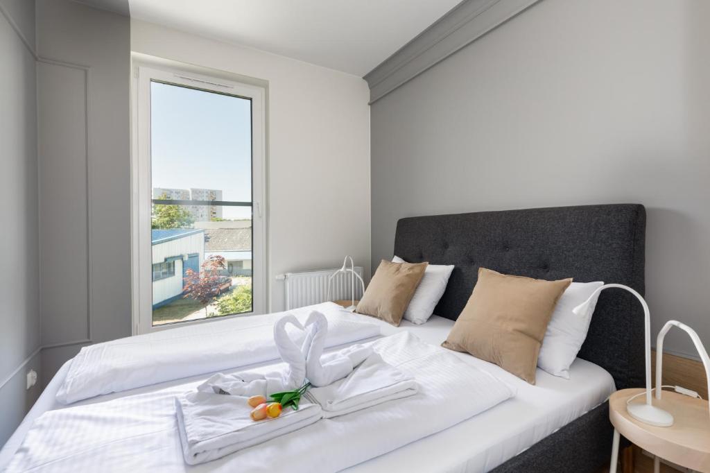 Posteľ alebo postele v izbe v ubytovaní Green Square Apartments Świnoujście by Noclegi Renters