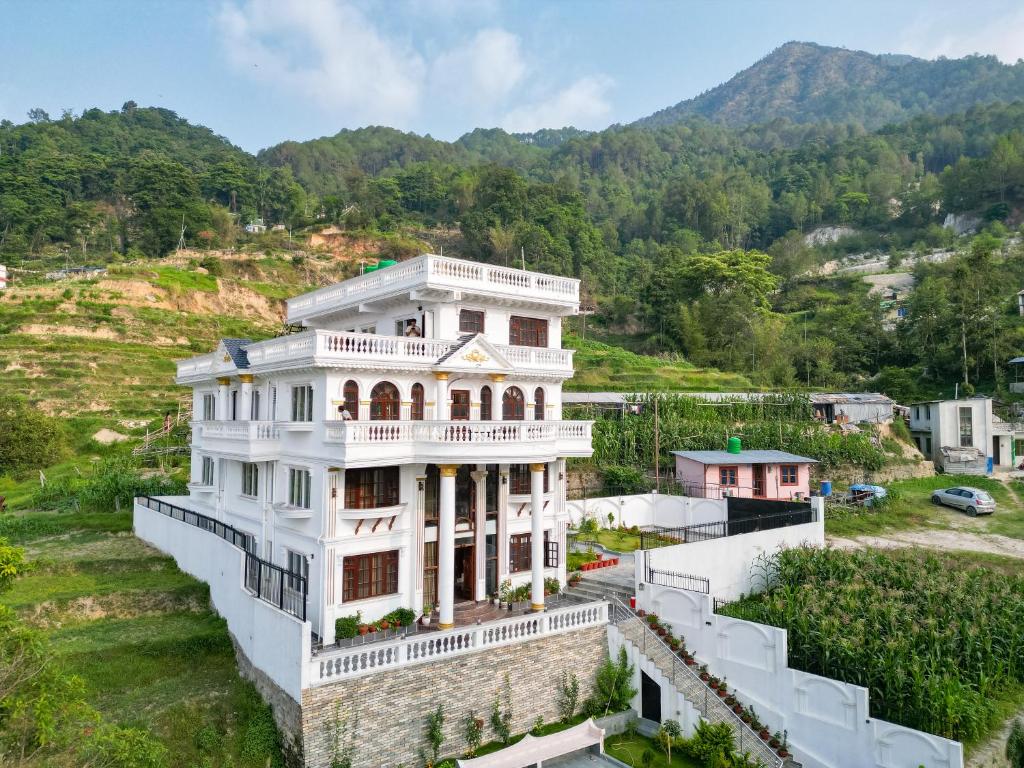 an aerial view of a house in the mountains at The White House Villa 8 bedroom with Swimming Pool in Kathmandu