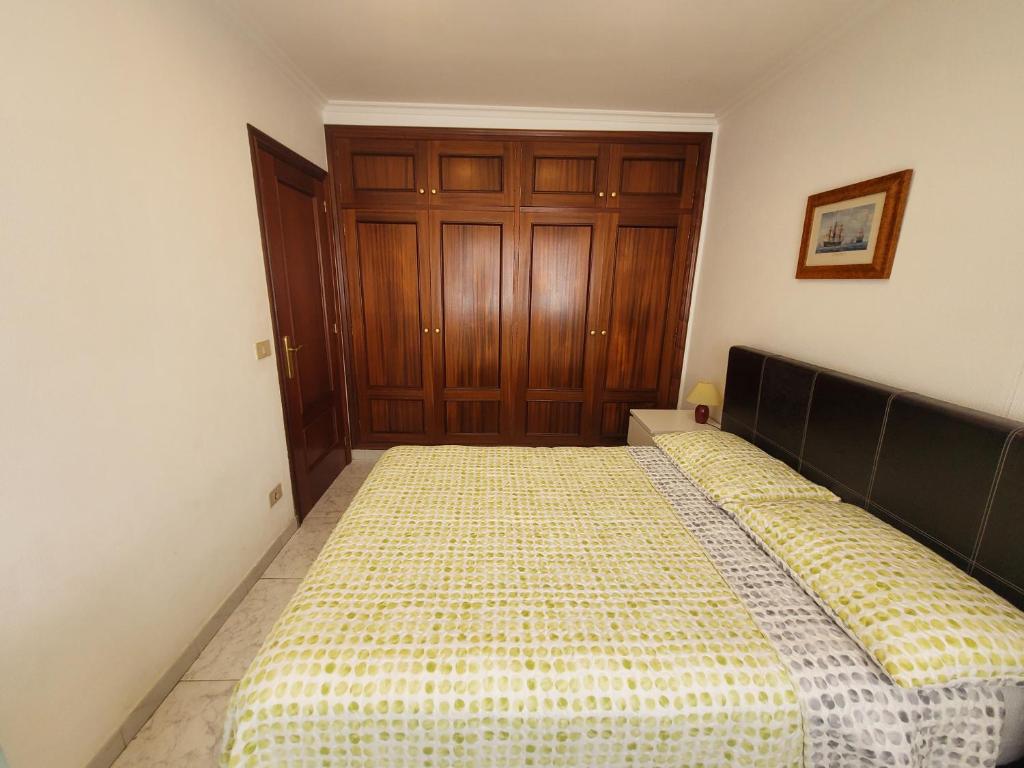Posteľ alebo postele v izbe v ubytovaní Apartamento playa Sanxenxo