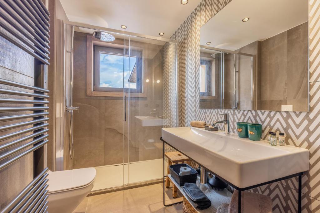 a bathroom with a sink and a shower at Bleu Eskape - Appartement in Megève