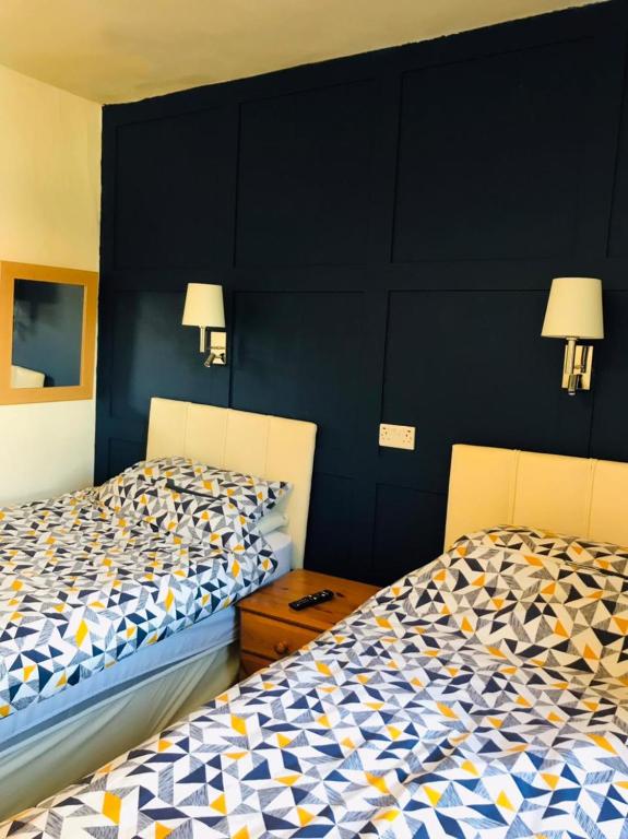 Postel nebo postele na pokoji v ubytování Wharfe View B&B