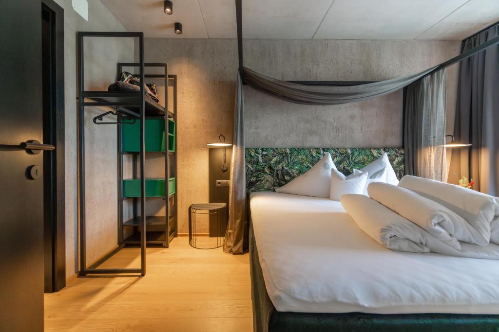 Postel nebo postele na pokoji v ubytování Lifesteil Aparthotel