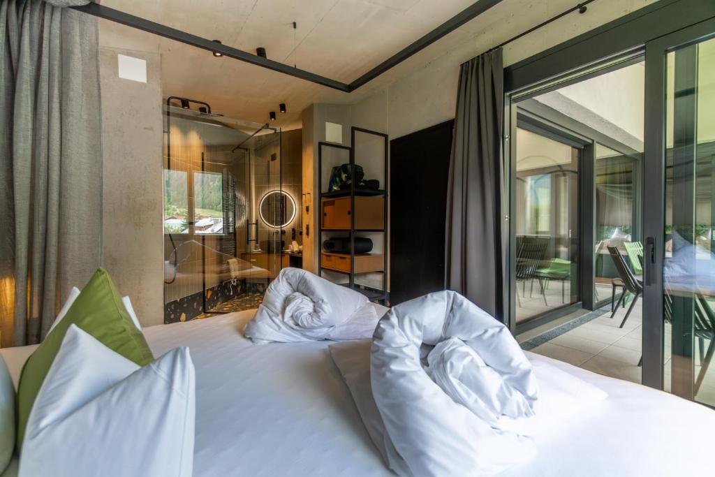 Postel nebo postele na pokoji v ubytování Lifesteil Aparthotel