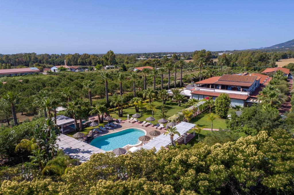 an aerial view of a resort with a swimming pool at Hotel Rurale Orti di Nora & SPA in Santa Margherita di Pula