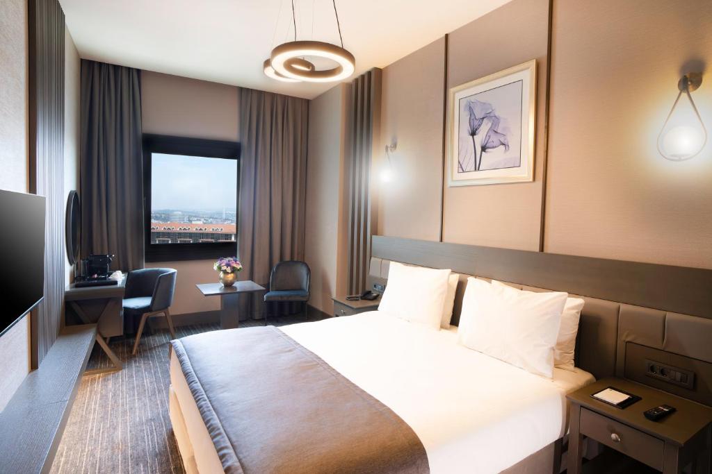 Arts Hotel Taksim客房内的一张或多张床位