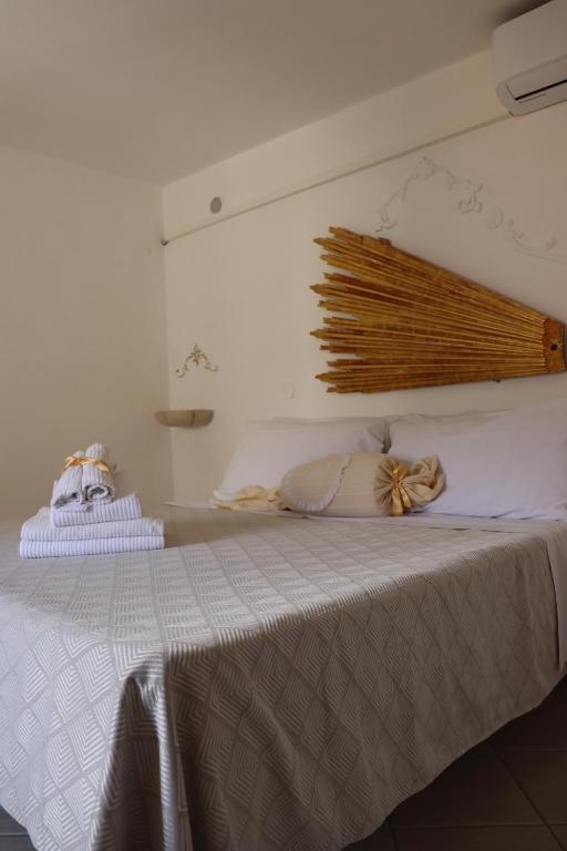 Postel nebo postele na pokoji v ubytování Palazzo Nari