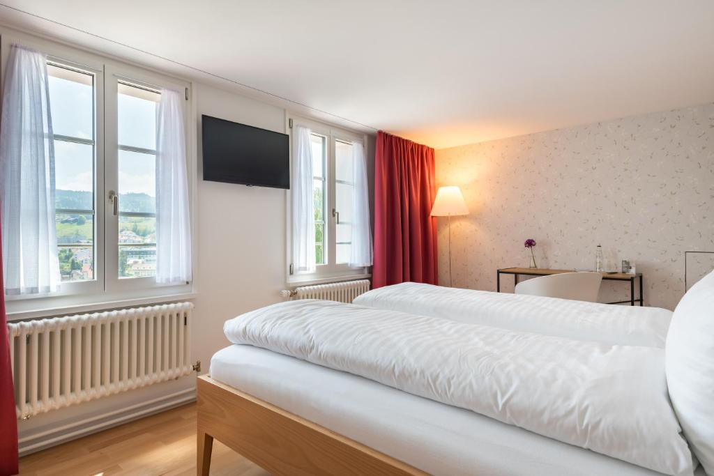 Postel nebo postele na pokoji v ubytování Linde Heiden Swiss Quality Hotel