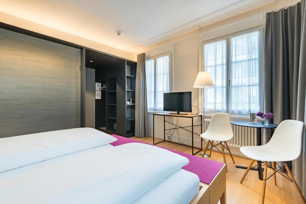 Postel nebo postele na pokoji v ubytování Linde Heiden Swiss Quality Hotel