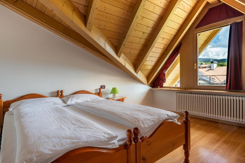 Postel nebo postele na pokoji v ubytování Agritur Cristina