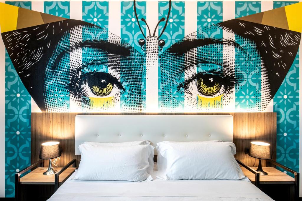 Postel nebo postele na pokoji v ubytování Muraless Art Hotel - WorldHotels Crafted