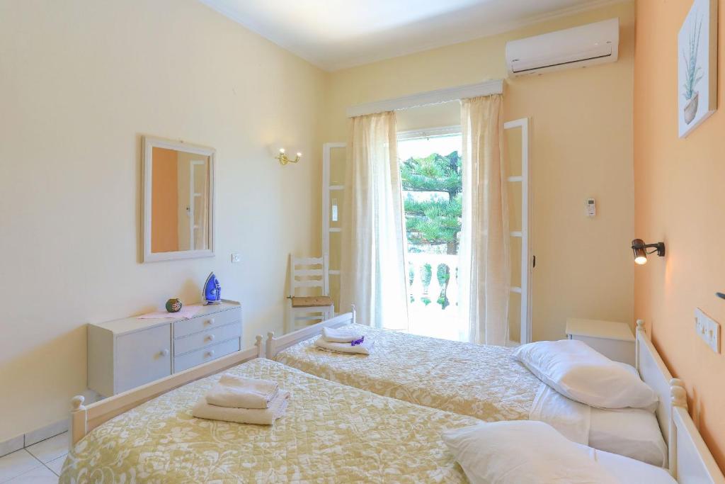 Postel nebo postele na pokoji v ubytování Fran Apartments