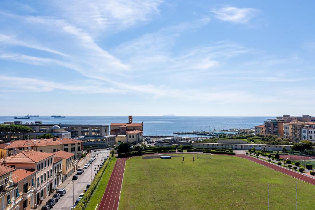 an aerial view of a city with the ocean at Livorno - Sea View Apartment! in Livorno