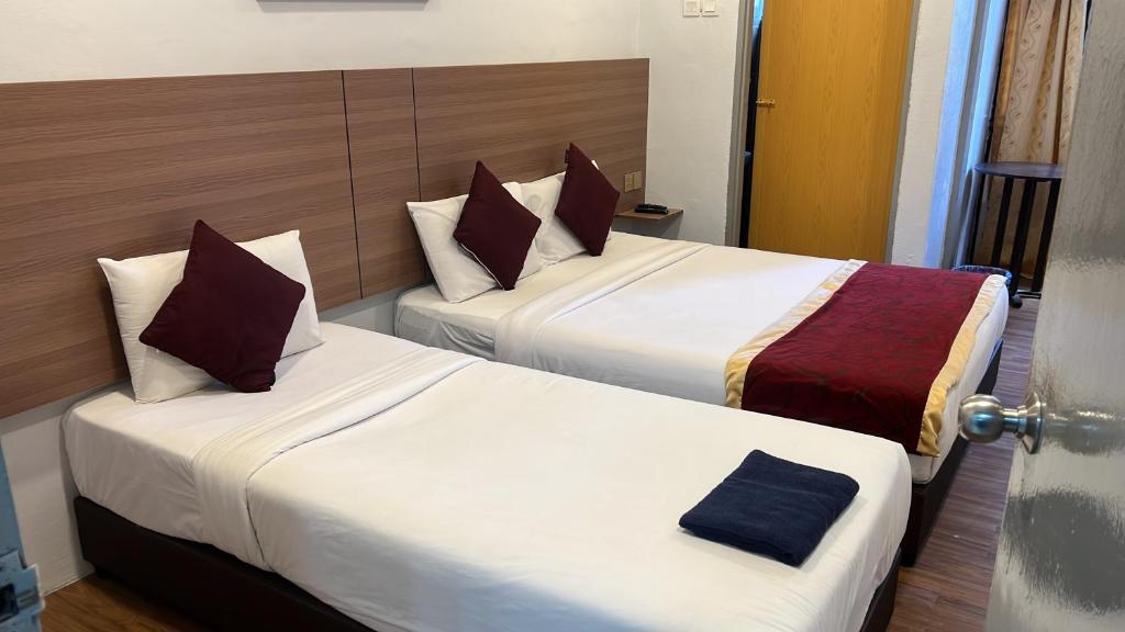 Postel nebo postele na pokoji v ubytování ESM Hotel