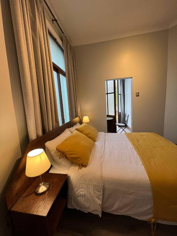 Postel nebo postele na pokoji v ubytování Hotel Casa Aure