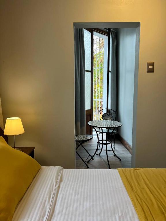 Postel nebo postele na pokoji v ubytování Hotel Casa Aure