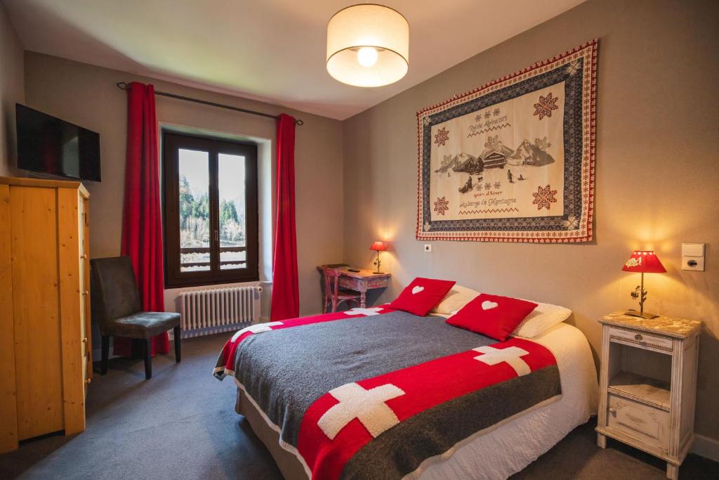 Postel nebo postele na pokoji v ubytování Hôtel Viallet