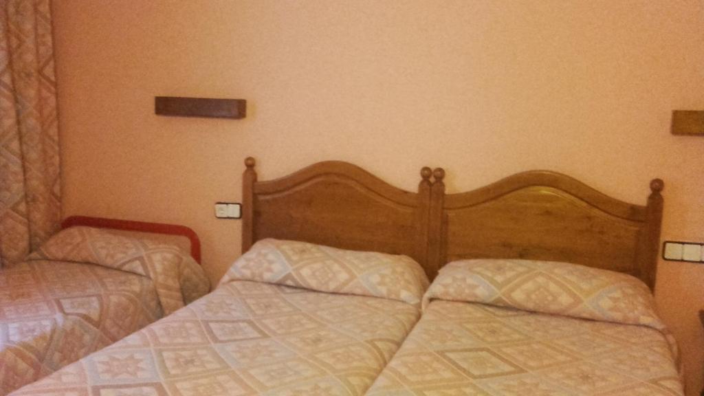 Postel nebo postele na pokoji v ubytování San Glorio