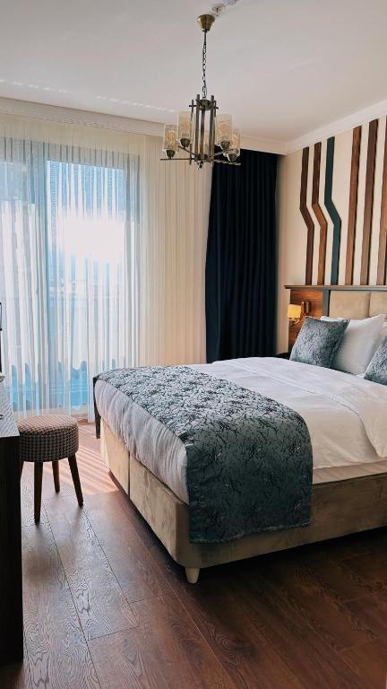Postel nebo postele na pokoji v ubytování BİLİRİS HOTEL