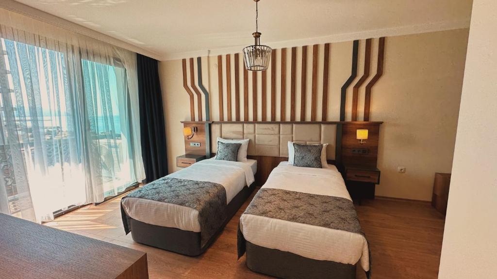 Postel nebo postele na pokoji v ubytování BİLİRİS HOTEL