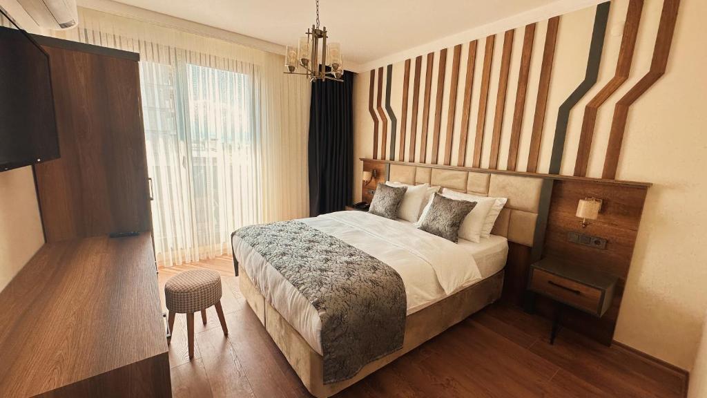 Postel nebo postele na pokoji v ubytování BİLİRİS HOTEL