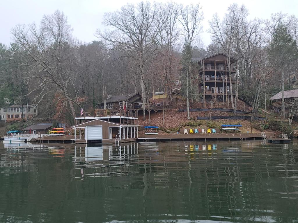 a small house on a dock on a lake at White Oak Point on Lake Lure in Lake Lure