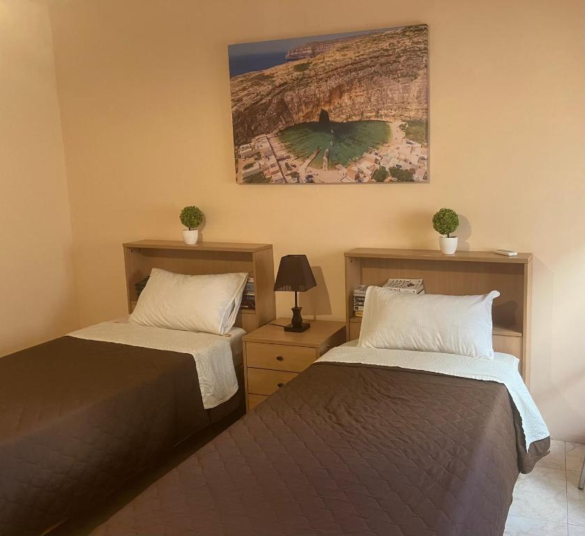 Postel nebo postele na pokoji v ubytování Victoria Penthouse