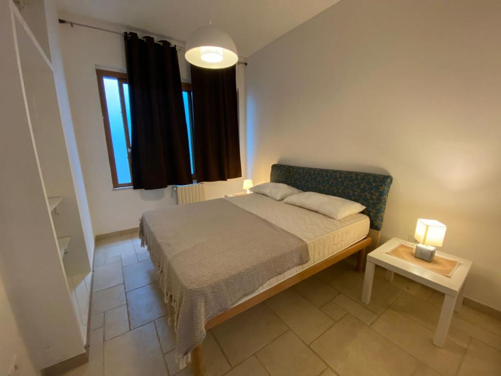 Postel nebo postele na pokoji v ubytování Villa Giulio Polignano