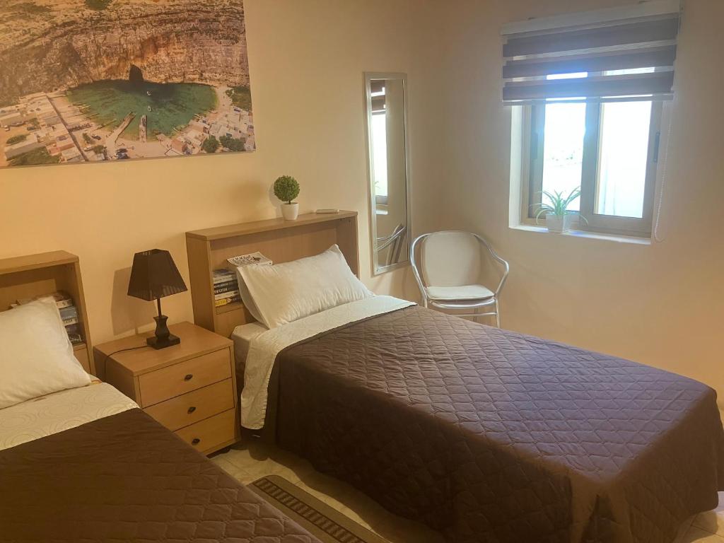 Postel nebo postele na pokoji v ubytování Victoria Penthouse