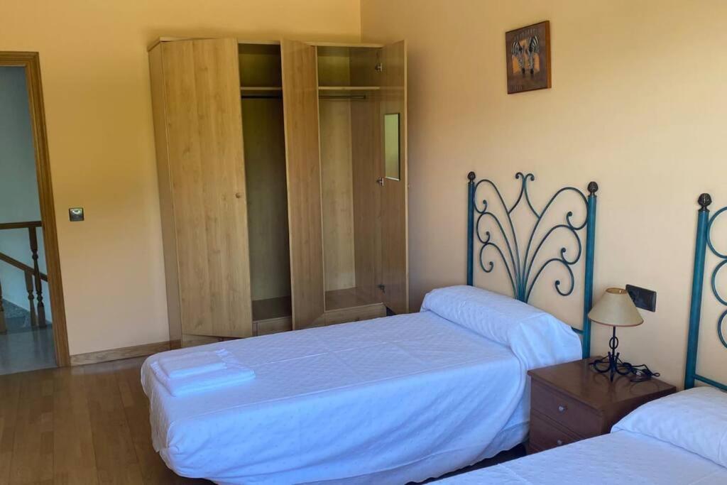 Postel nebo postele na pokoji v ubytování VILLA SOLLEIRO