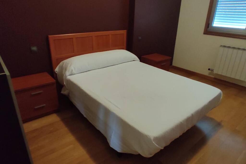 Postel nebo postele na pokoji v ubytování VILLA SOLLEIRO