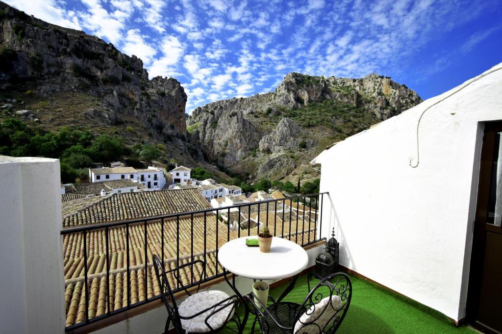 a balcony with a view of a mountain at EL HECHIZO DEL BAILÓN in Zuheros