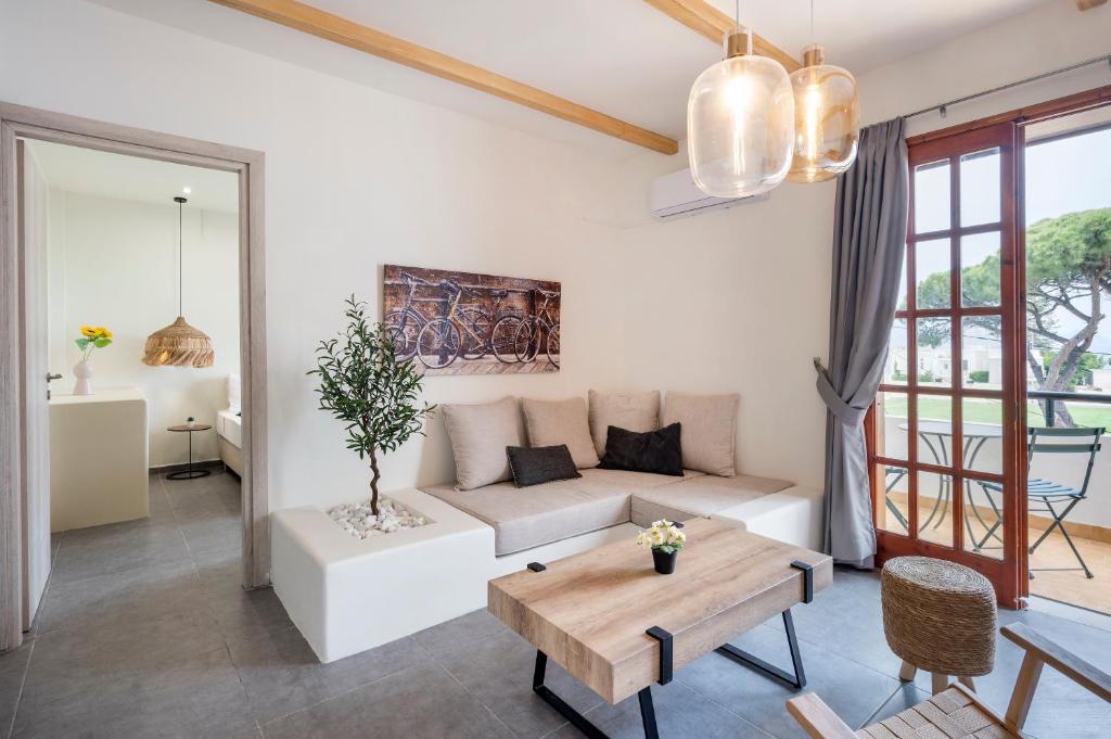 a living room with a couch and a table at Jonathan City Apartment in Kos Town